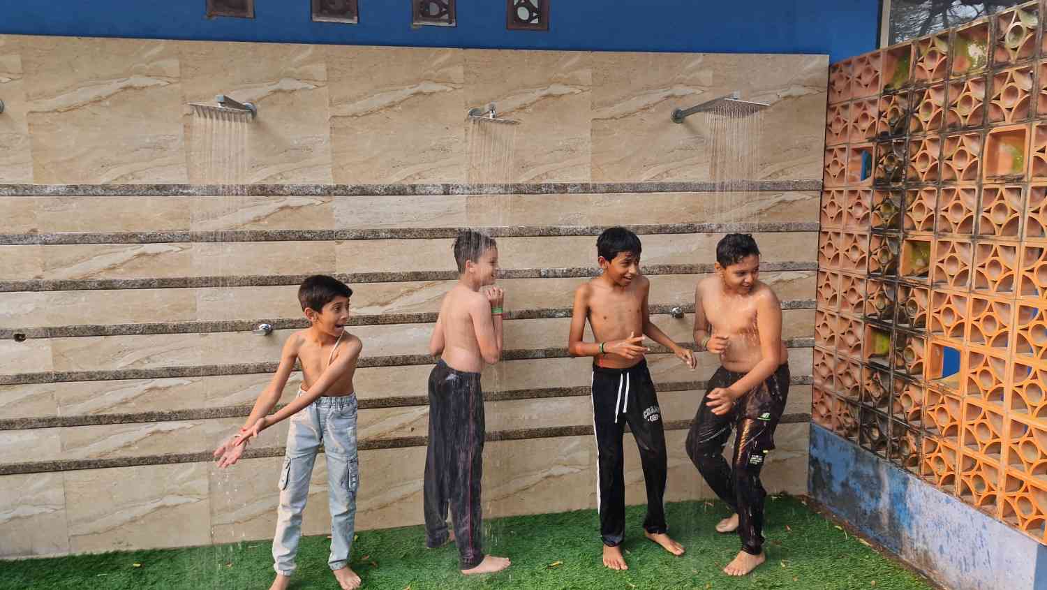 Children enjoying the water showers