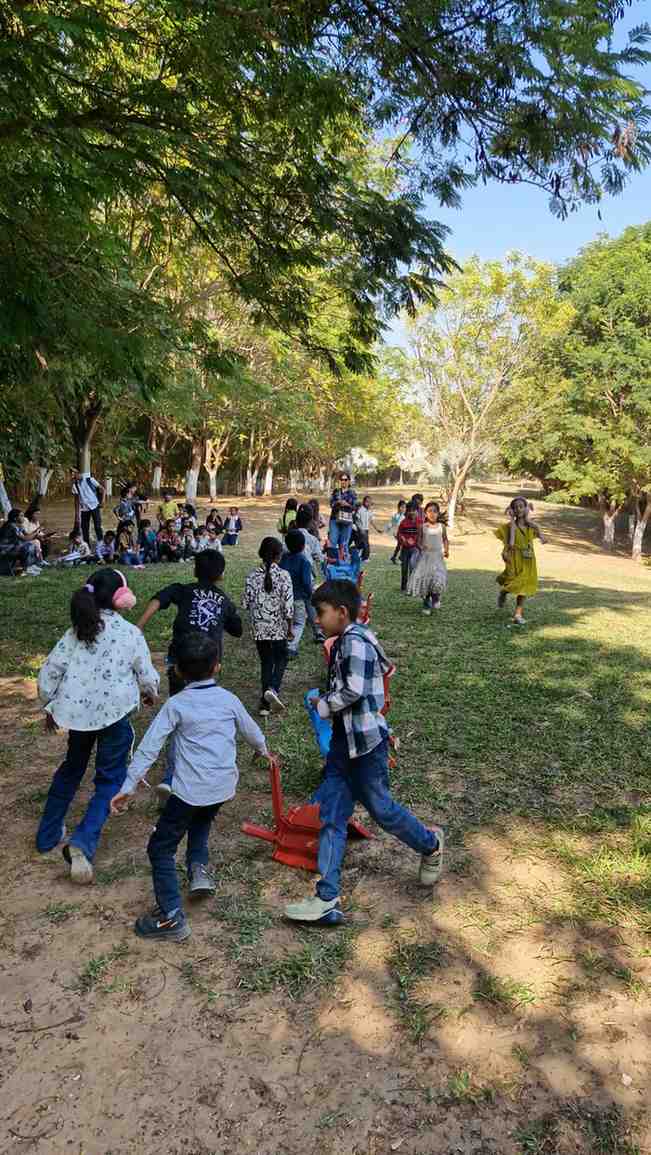 Children running in a line outdoors