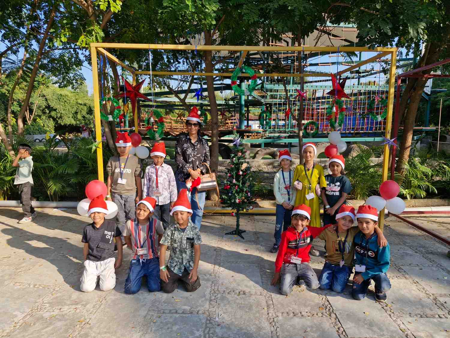 School kids celebrating Christmas at an outdoor campsite