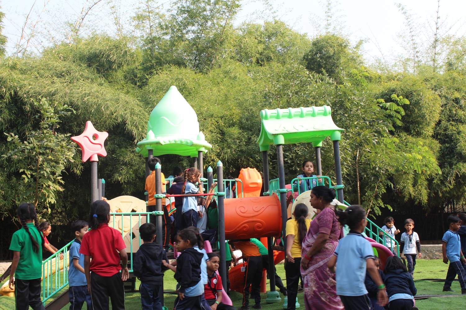 Kids playing on colorful playground equipment