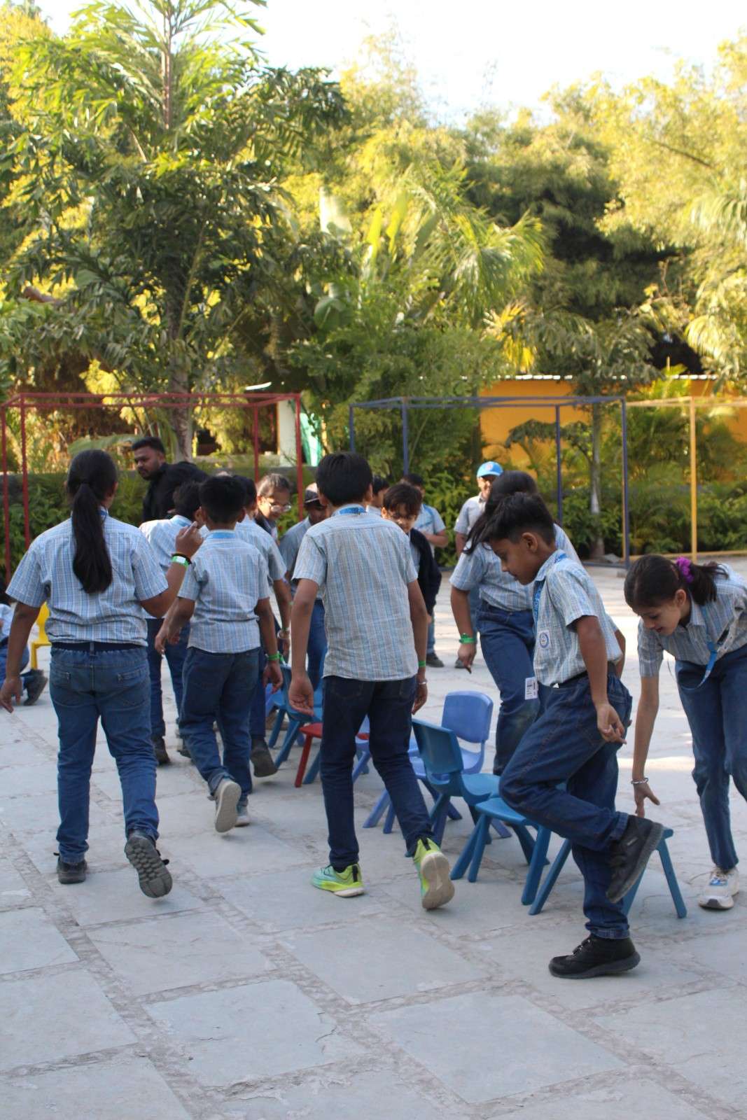 Group of students playing musical chairs outdoors