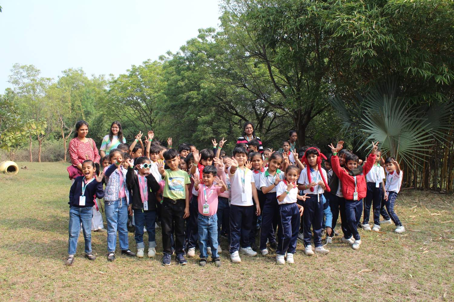 Group posing in lush green garden