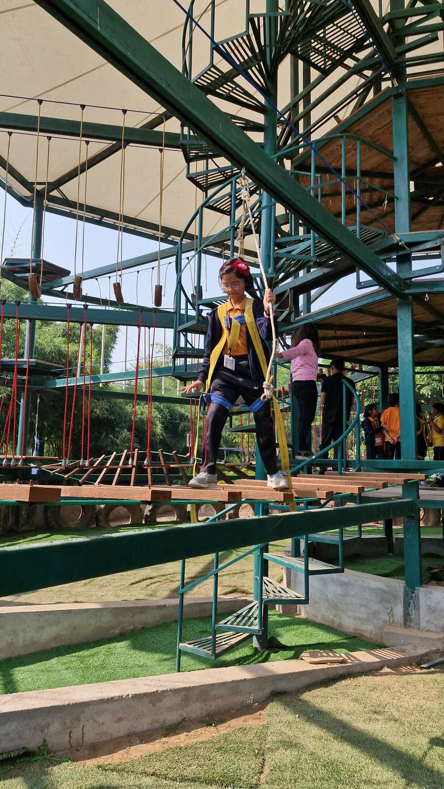 Students on multi-level adventure tower course