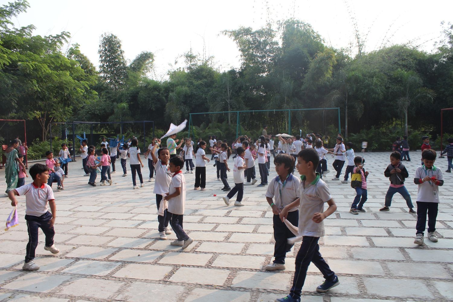 Students playing handkerchief games in courtyard