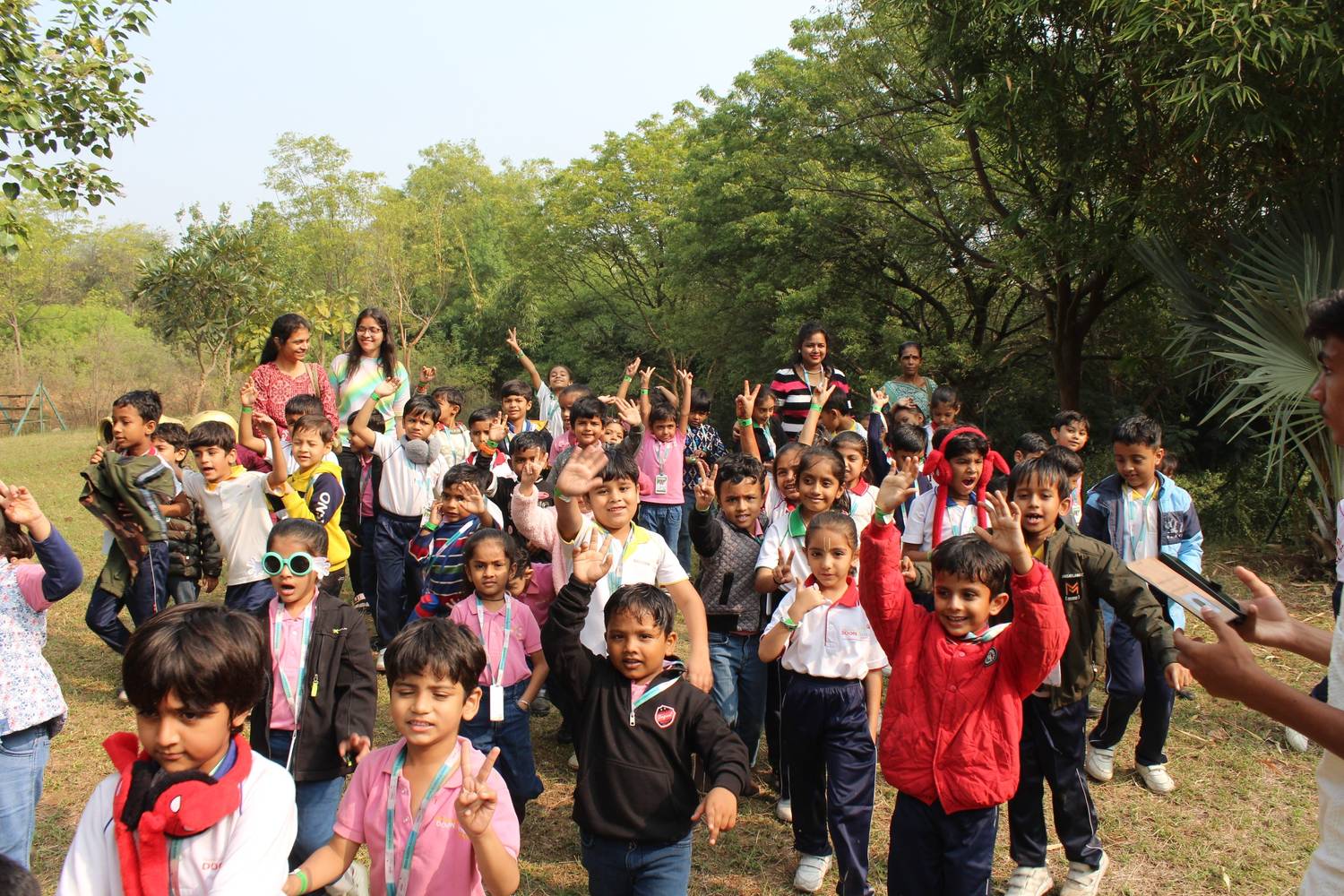 Excited students cheering during nature trip