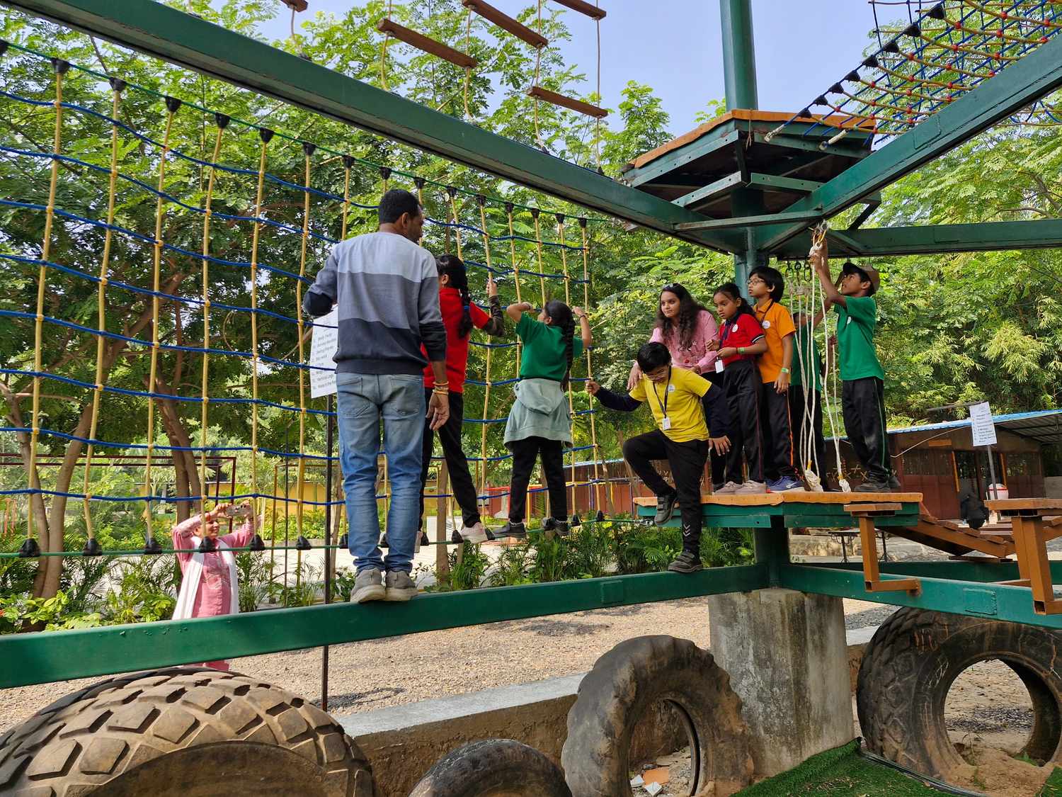 Kids crossing tire obstacle course