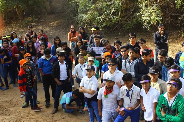 Large group of students waiting at the start of trekking trail