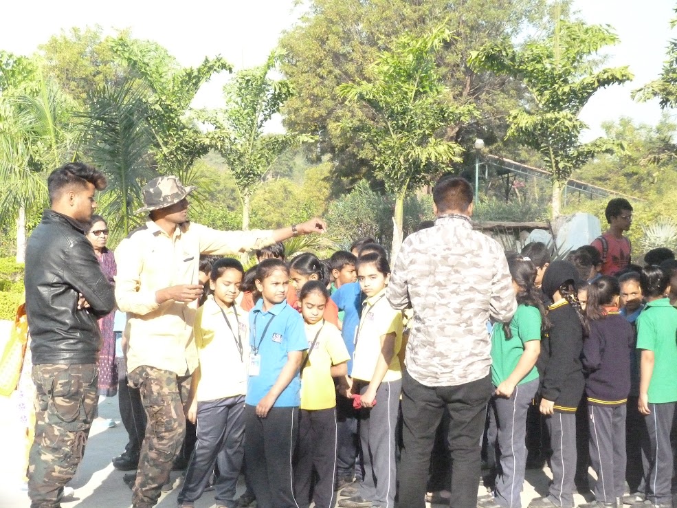 Nature guide explaining local plants to students