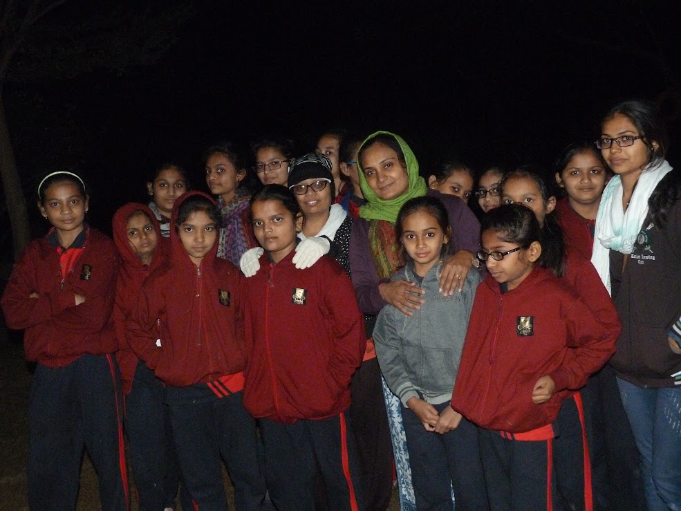 Students gathered together for night camp activities