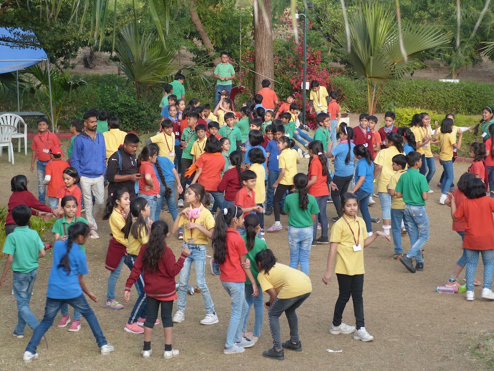 Group of students playing outdoor games on the lawn