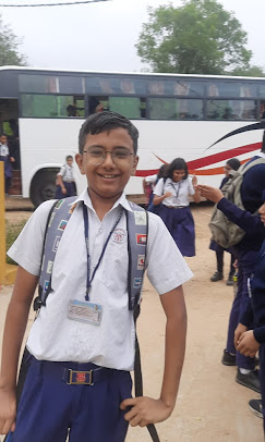 Students arriving at the campsite by bus