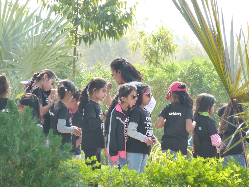 Students enjoying nature walk and conversation at AARTI Campsite